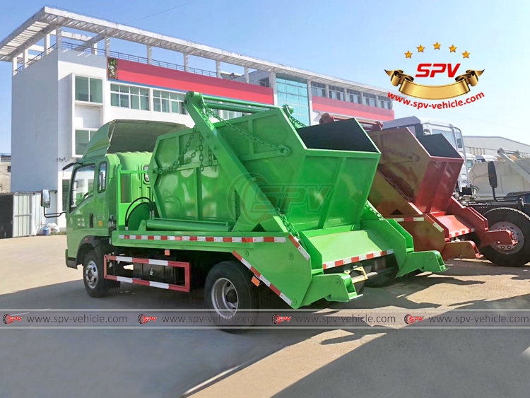 Green and Red Skip Loader Garbage Trucks