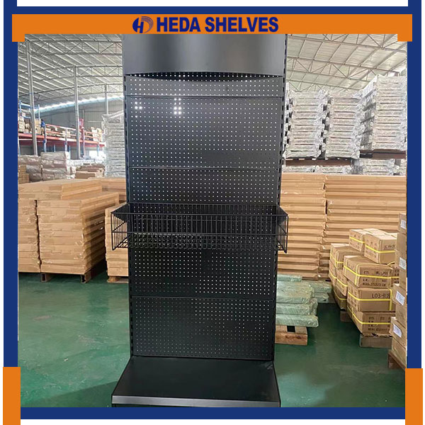 Front view of the real HEDA PDS04 tool display stand showing a plain curved top header, black round-hole pegboard, single wire basket and open lower metal base