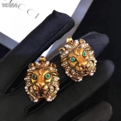 Gucci aged gold finish Lion head earrings with pearls green crystals eyes pierced