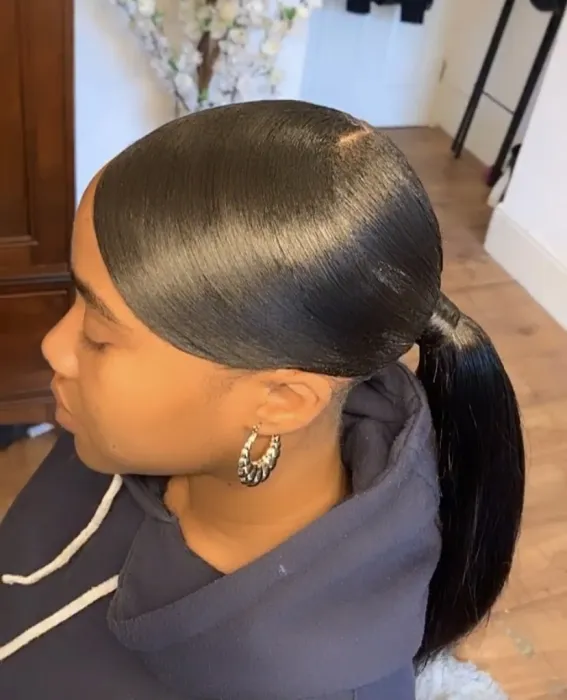 low sleek ponytail style for black women