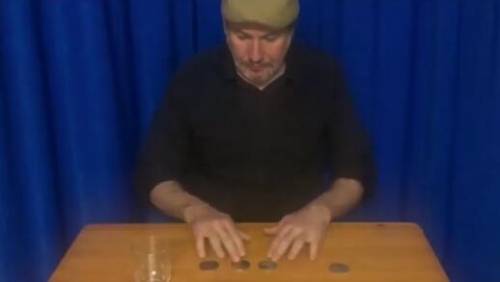 Coins Through the Table by Joaquin Matas