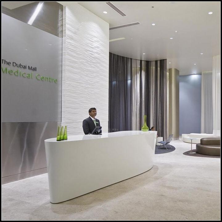 Modern mall center lobby small white solid surface standing reception desk