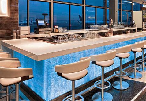 blue glass and acrylic solid surface countertop bar