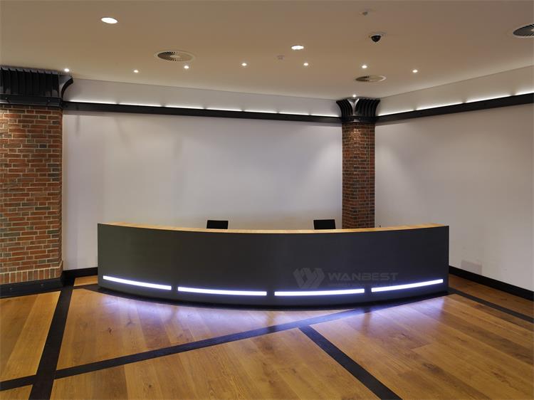 semicircular black reception desk