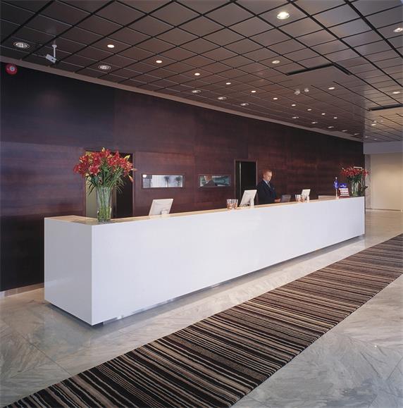 Long white clinic reception desk