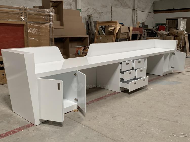 Large reception desk with many cabinets 