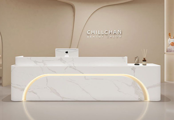 White simple marble  nail salon hotel reception desk
