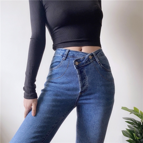 Stretch denim pants with diagonal buttons