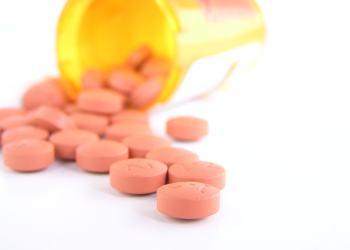 Pink tablets engraved with patterns