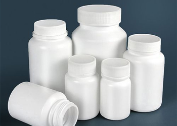 Many plastic bottles of different diameters