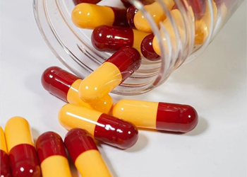 A bottle of two-color capsules