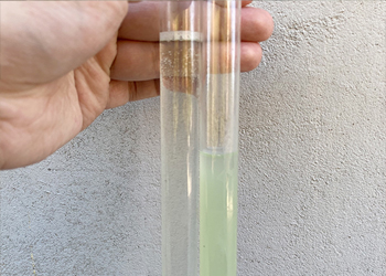 Transparent liquid after efficient clarification by disc separator, demonstrating doubled separation efficiency