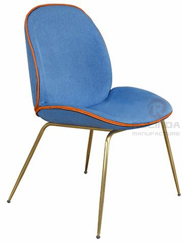 Danish design replicates the golden leg furniture of the Guppy Beetle dining chair