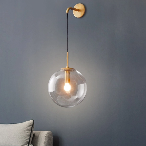 Modern Style 7.8'' Wide Hanging Wall Sconce with Clear Globe Glass Shade in Gold