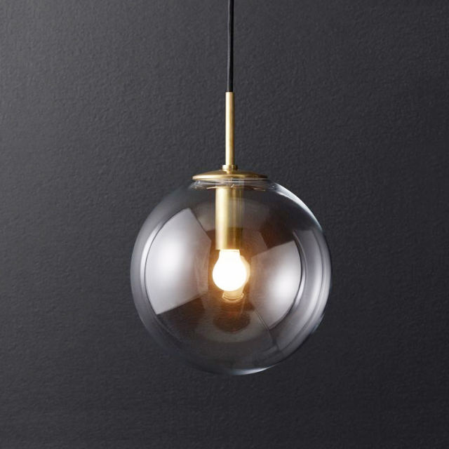 Modern Style 7.8'' Wide Hanging Wall Sconce with Clear Globe Glass Shade in Gold
