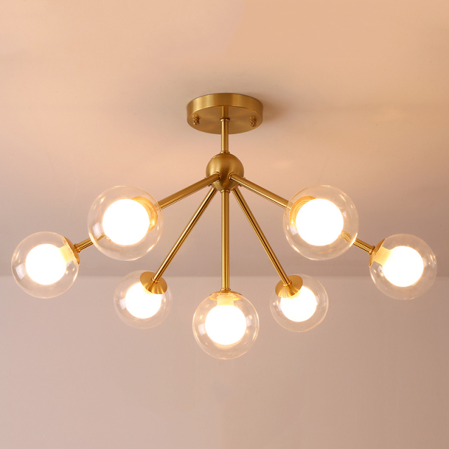 Modern 4 Light Semi Flush Ceiling light in Brass with Globe Glass Shade