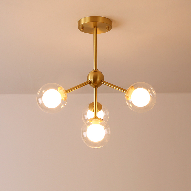 Modern 4 Light Semi Flush Ceiling light in Brass with Globe Glass Shade