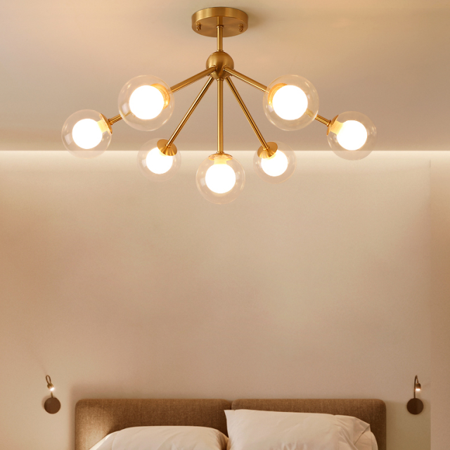 Modern 4 Light Semi Flush Ceiling light in Brass with Globe Glass Shade