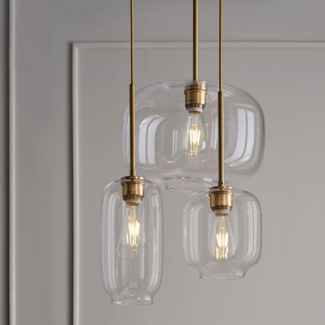 Mid Century Modern Glass Jar Pendant Light in Brass Over Kitchen Island Dining Table and Breakfast Bar Lighting