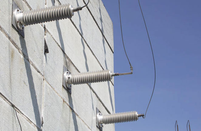 Wall bushings installed on an exterior building wall
