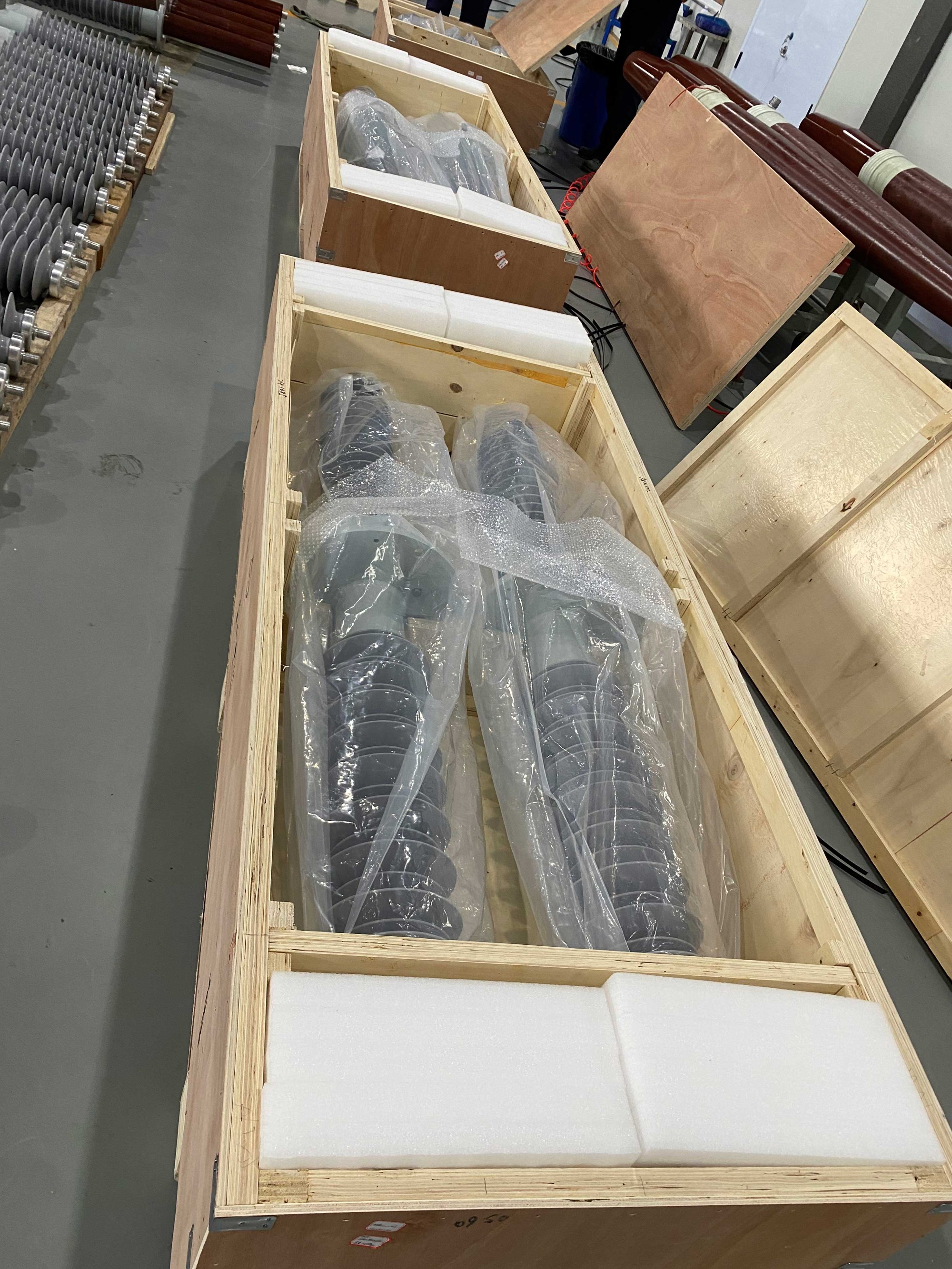 Large bushings cushioned and covered inside wooden export crates