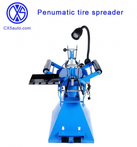 Penumatic tire spreader