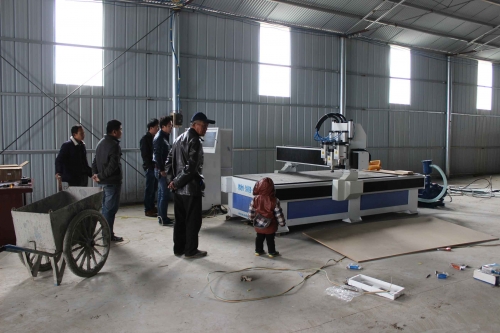 One set pneumatic three heads woodworking cnc router in customer