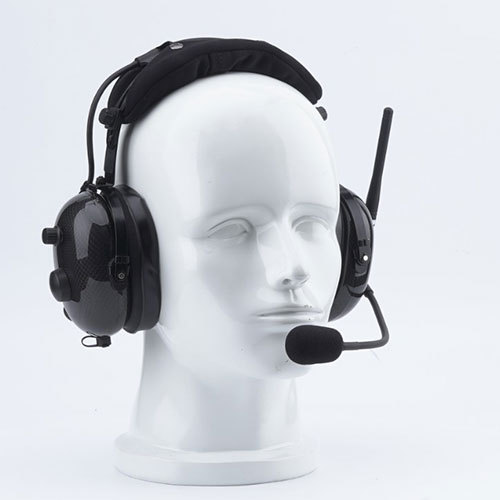 Over head noise-cancelling headset with two way radio integrated