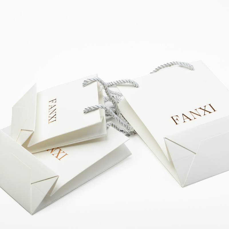 FANXI Custom Logo Packing Bags For Jewelry Watch Cloth Cosmetic Gift Shop White Coated Paper Packaging Bag