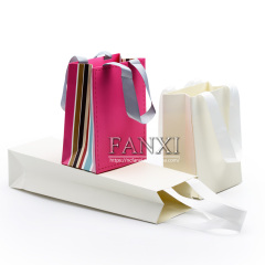 FANXI OEM Wholesale White Paper Pacckaging Bags For Gift Jewelry Cloth Shop Party Favors Custom Printed Paper Shopping Bag