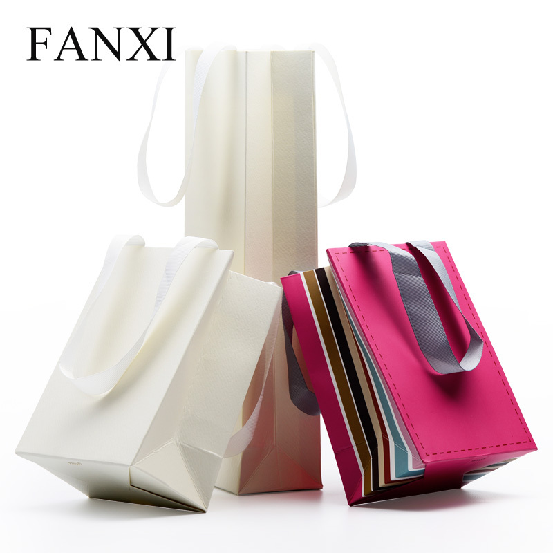 FANXI OEM Wholesale White Paper Pacckaging Bags For Gift Jewelry Cloth Shop Party Favors Custom Printed Paper Shopping Bag