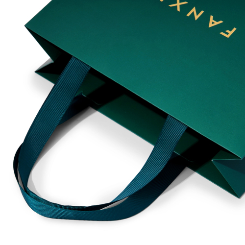 Dark green paper jewelry bag with matching ribbon