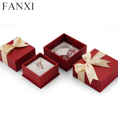 Red cardboard jewelry packaging box with bowknot