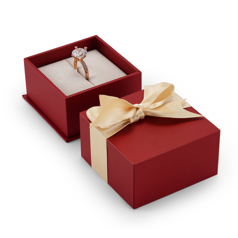 Red cardboard jewelry packaging box with bowknot