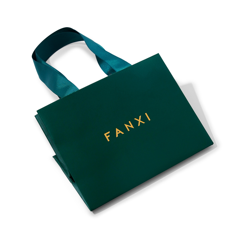 Dark green paper jewelry bag with matching ribbon