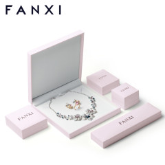 Pink jewelry packaging box with white velvet inside