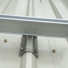 Trapezoidal metal roof sheet clamp