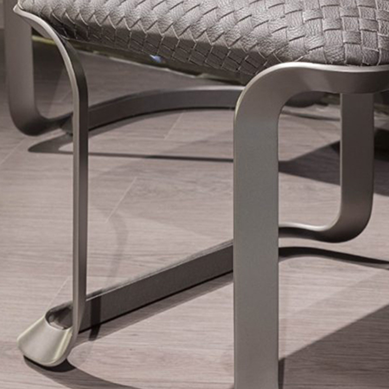 Stainless steel feet in nickel brushed chair