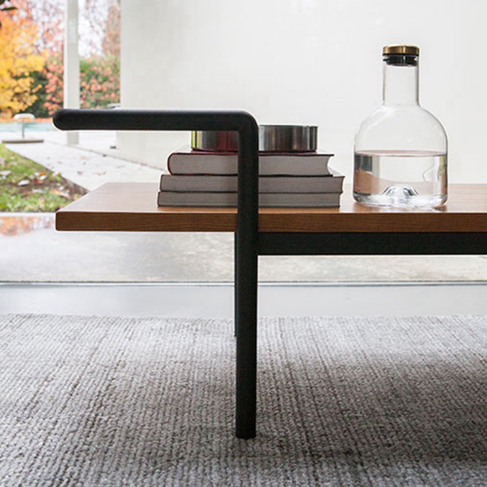 Matel in matt black match with MDF plywood veneered in walnut bed stool