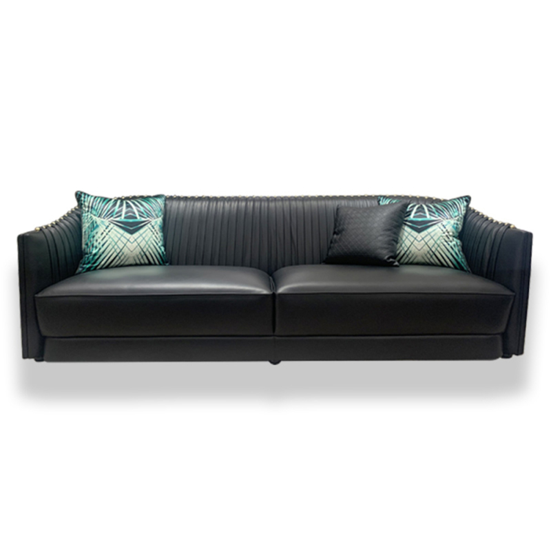 Black leather sofa with metal accents