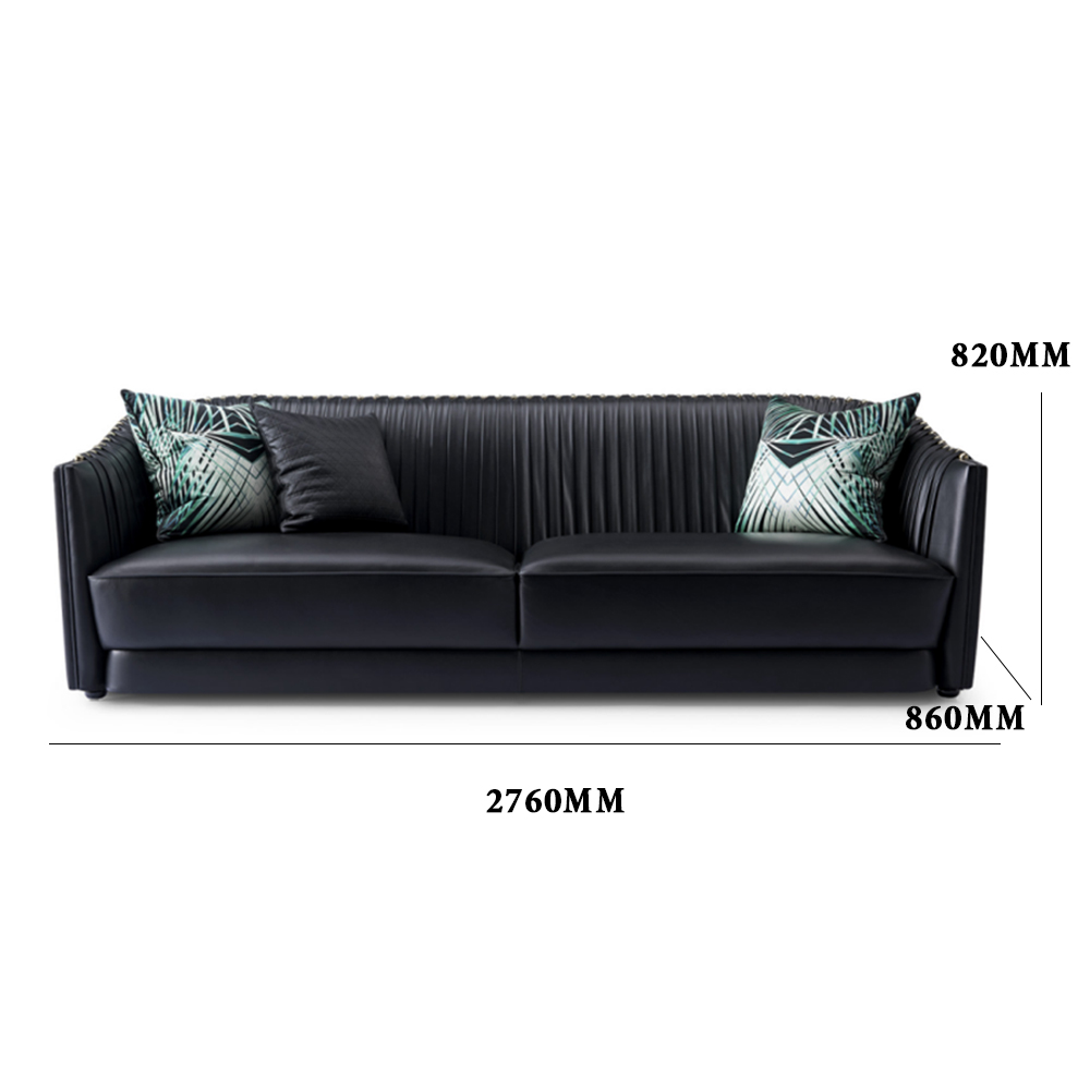 Black leather sofa with metal accents