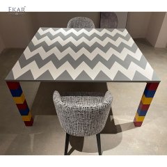 Gray and white stone mosaic tabletop, red, yellow and blue base dining table