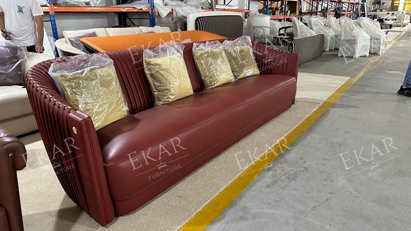 Black leather sofa with metal accents