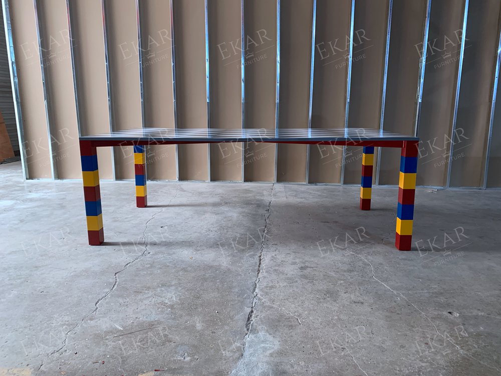 Gray and white stone mosaic tabletop, red, yellow and blue base dining table