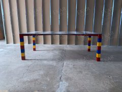 Gray and white stone mosaic tabletop, red, yellow and blue base dining table