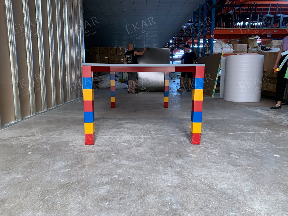 Gray and white stone mosaic tabletop, red, yellow and blue base dining table