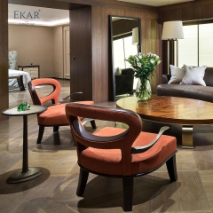 Modern brass arm plush lounge chair with openwork backrest and ergonomic support