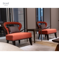 Modern brass arm plush lounge chair with openwork backrest and ergonomic support