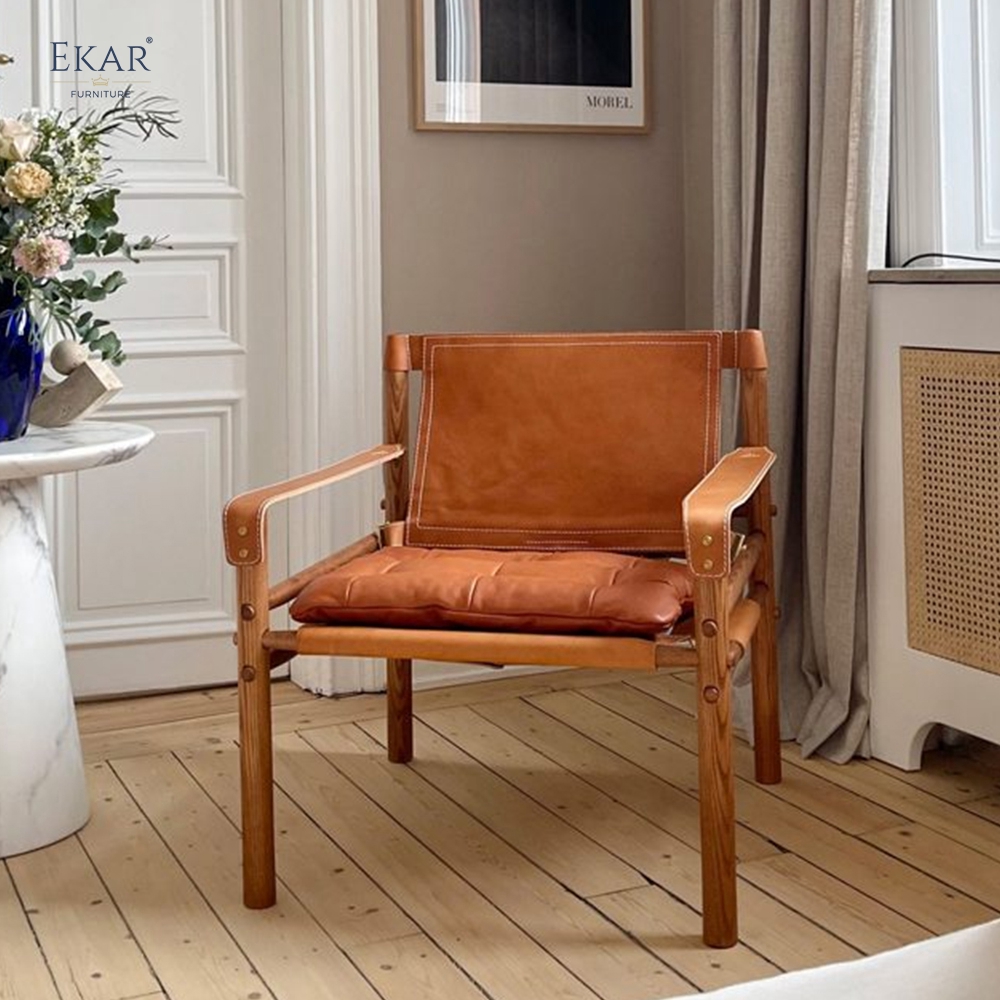 Modern Leisure Chair – Safari-Inspired Leather Sling Armchair for Contemporary Interiors