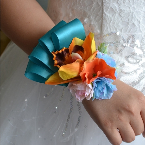 Orange Lily Wrist Corsage with Blue Ribbon